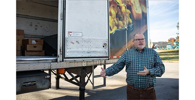 Ben Kirtley, coordinator of Family Resource and Youth Services Centers for Warren County Public Schools, talks about the turkey drive the school district is hosting beside a refrigerated truck trailer containing a few dozen turkeys already collected at the WCPS central office on Friday, Nov. 8, 2024. WCPS is partnering with local organizations, as well as seeking frozen turkey and chicken from community members, to provide Thanksgiving meals to families of students. (Grace McDowell/gtrace.mcdowell@bgdailynews.com)