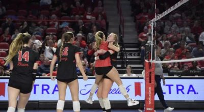 Western Kentucky players celebrate during Friday's 3-1 volleyball win against Liberty at E.A. Diddle Arena. (WKU ATHLETICS)