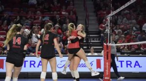 Western Kentucky players celebrate during Friday's 3-1 volleyball win against Liberty at E.A. Diddle Arena. (WKU ATHLETICS)