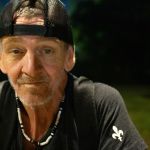 Timothy Hayes, who lost his home in the 2021 tornado outbreak, sits on his bike. The Safer Kentucky Act has made finding a place a to rest more difficult for him and other homeless residents, they say.