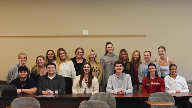 Western Kentucky University public relations classmates pose for a picture Tuesday in a classroom at Gary A. Randsell Hall. They’re campaigning for multiple local causes.