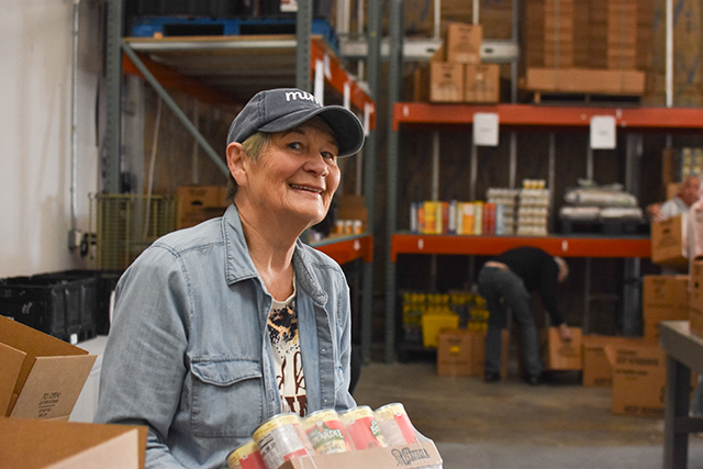 Deedy Whittamore, a member of the Faith Methodist Church, on Tuesday picks up food at House on the Hill — non-perishables donated within Warren County through United Way of Southern Kentucky's Feed the Need food drive.