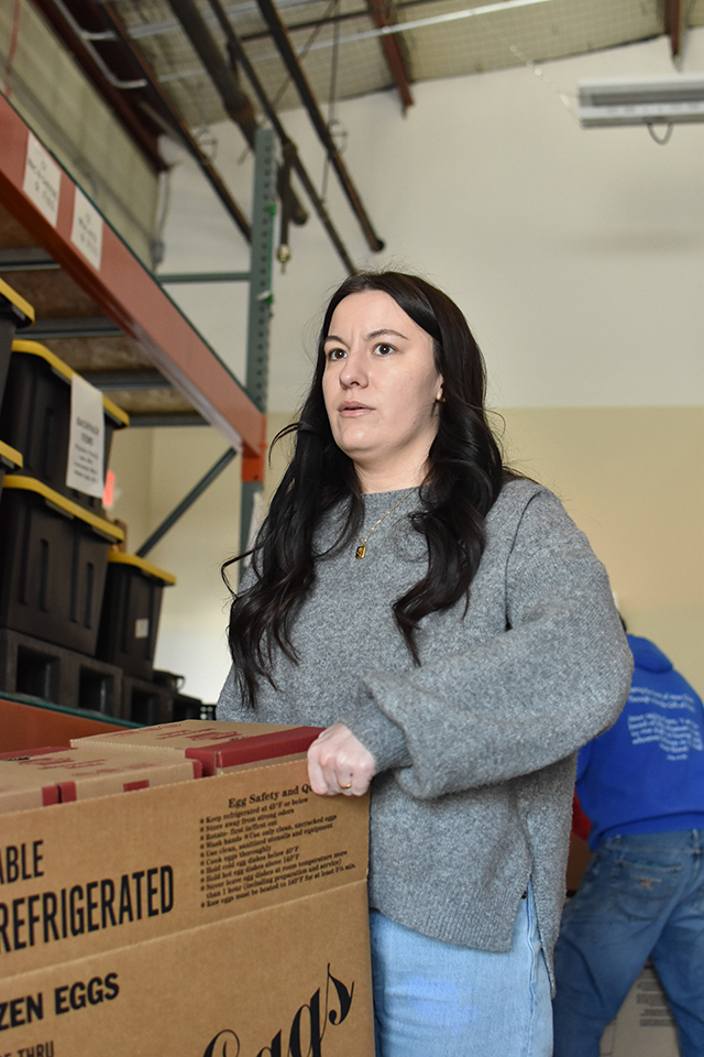 Adela Muhic, director of development at the Barren River Area Safe Space, on Tuesday picks up food at House on the Hill — non-perishables donated within Warren County through United Way of Southern Kentucky's Feed the Need food drive.