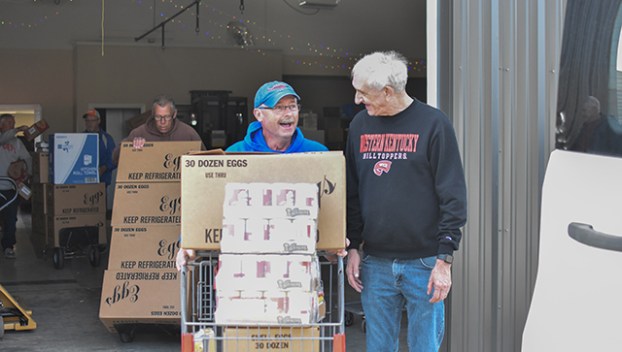 Chris Johnson and Dennis Lott, from Calvary Baptist Church, on Tuesday pick up food at House on the Hill — non-perishables donated within Warren County through United Way of Southern Kentucky's Feed the Need food drive.
