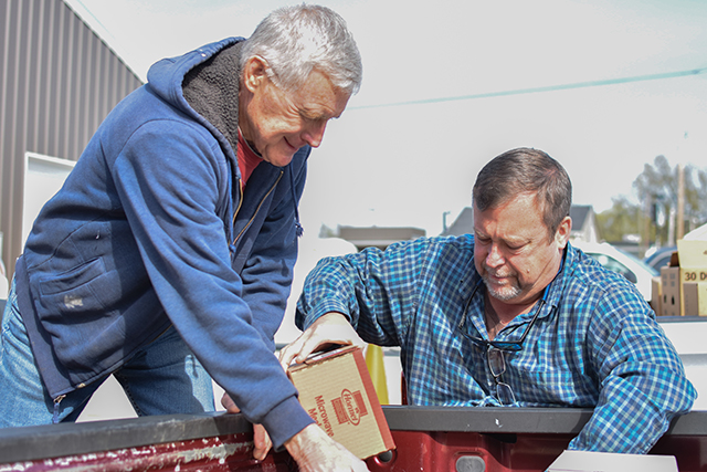 Lloyd Crabbe and Kevin Crabbe, from St. Joseph SVDP Food Pantry, load non-perishables onto a truck that were donated within Warren County through United Way of Southern Kentucky's Feed the Need food drive.