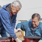 Lloyd Crabbe and Kevin Crabbe, from St. Joseph SVDP Food Pantry, load non-perishables onto a truck that were donated within Warren County through United Way of Southern Kentucky's Feed the Need food drive.