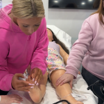 Students at the Logan County Career & Technical Center work in the nonprofit HealthForce Kentucky's mobile simulation center, HealthForce One, in March.