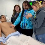 Students at the Logan County Career & Technical Center work in the nonprofit HealthForce Kentucky's mobile simulation center, HealthForce One, in March.