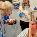 Students at the Logan County Career & Technical Center work in the nonprofit HealthForce Kentucky's mobile simulation center, HealthForce One, in March.