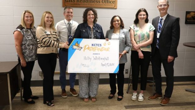 Holly Whittinghill (center) is honored with the Pathfinder Award. (SUBMITTED)