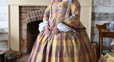Susan Lyons Hughes models a historically accurate dress made for her reenactment of Nancy Hammond Duncan in an upcoming documentary on the historic Duncan Inn.