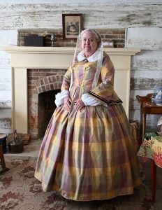Susan Lyons Hughes models a historically accurate dress made for her reenactment of Nancy Hammond Duncan in an upcoming documentary on the historic Duncan Inn.