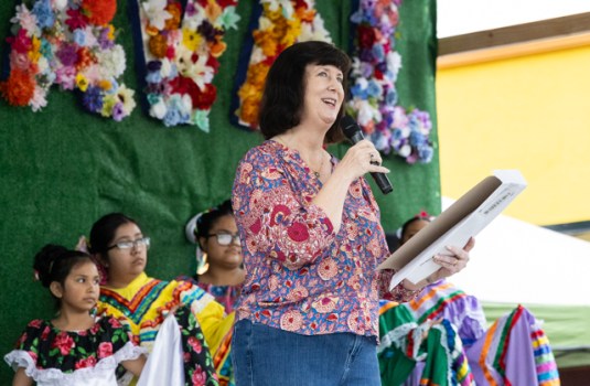 Former State Rep. Patti Minter reads an acclamation from Gov. Andy Beshear to pay tribute to BG Fiestaval organizers, participants and performers for celebrating the local Latino and Hispanic communities through the biannual BG Fiestaval events during a special ceremony at the fiesta celebration off Clay Street on Saturday, May 3, 2025.
GRACE MCDOWELL / DAILY NEWS