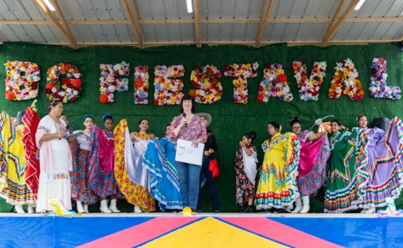 Former State Rep. Patti Minter reads an acclamation from Gov. Andy Beshear to pay tribute to BG Fiestaval organizers, participants and performers for celebrating the local Latino and Hispanic communities through the biannual BG Fiestaval events during a special ceremony at the fiesta celebration off Clay Street on Saturday, May 3, 2025.
GRACE MCDOWELL / DAILY NEWS