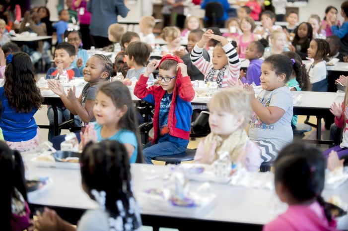 Picture of Dishman-Mcginnis Elementary School students singing "happy birthday" Wednesday, September 13, 2017, during a birthday celebration for cafeteria worker Mary Cox Anthony at the school. (Bac Totrong/photo@bgdailynews.com)