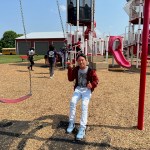 Picture of then-Teranga Academy student Ernesto Manuel-Andres sits on a swing at Chaney's Dairy Barn during a field trip last summer. (SUBMITTED)