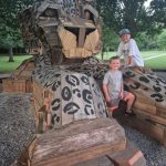 Picture of two kids by the jaguar giant sculpture