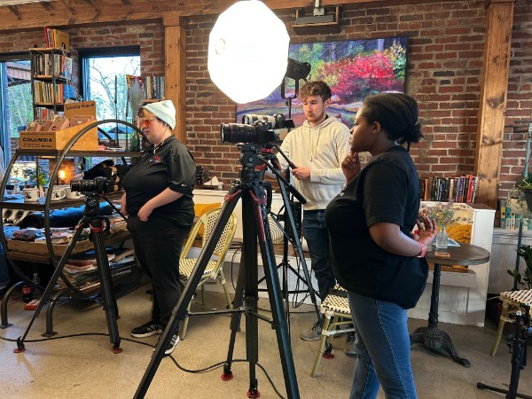 Photograph of WKU Public Media students working alongside staff to produce an episode featuring the Americana act "Goldpine" for Lost River Sessions. (SUBMITTED BY WKU Public Media)