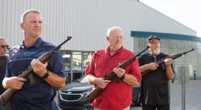 Photograph of Kip Black (from left) directing Jason Tippett, Richard Ewald and Gerald Head through the three-volley military salute as the Logan County veterans, alongside other members of the Logan County Honor Guard, hold their weekly practice Thursday in Russellville.